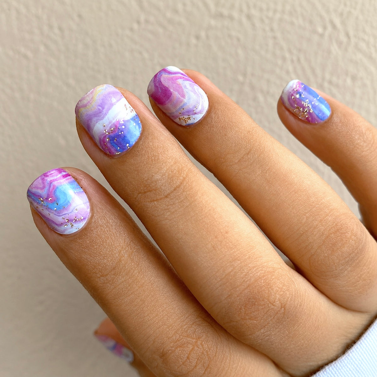 Nails wearing Pink Galaxy Nail wraps by Namora
