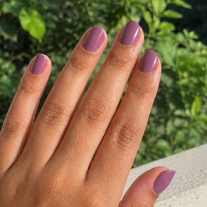 Hand wearing Deep Plum nail Wraps by Namora