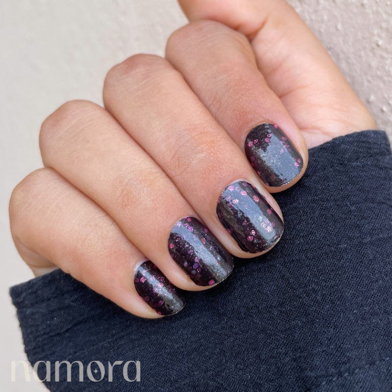 Hand with gala night nail wraps by namora