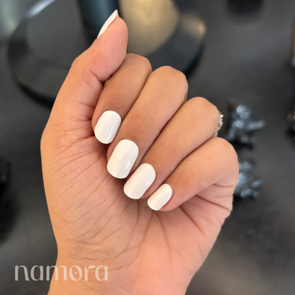 Hand wearing Blush Ivory nail Wraps by namora