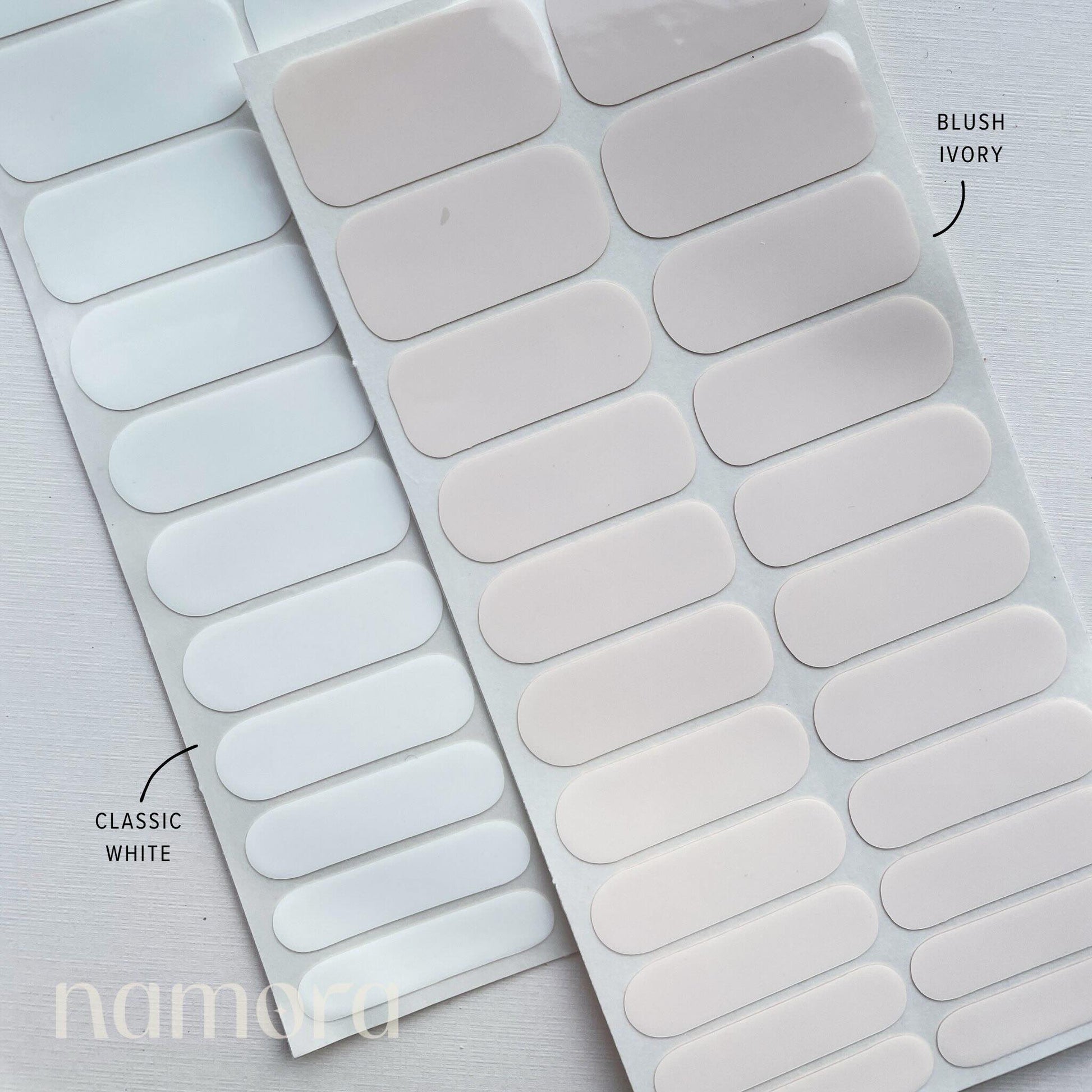 Strips of blush ivory and classic white nail wraps by namora
