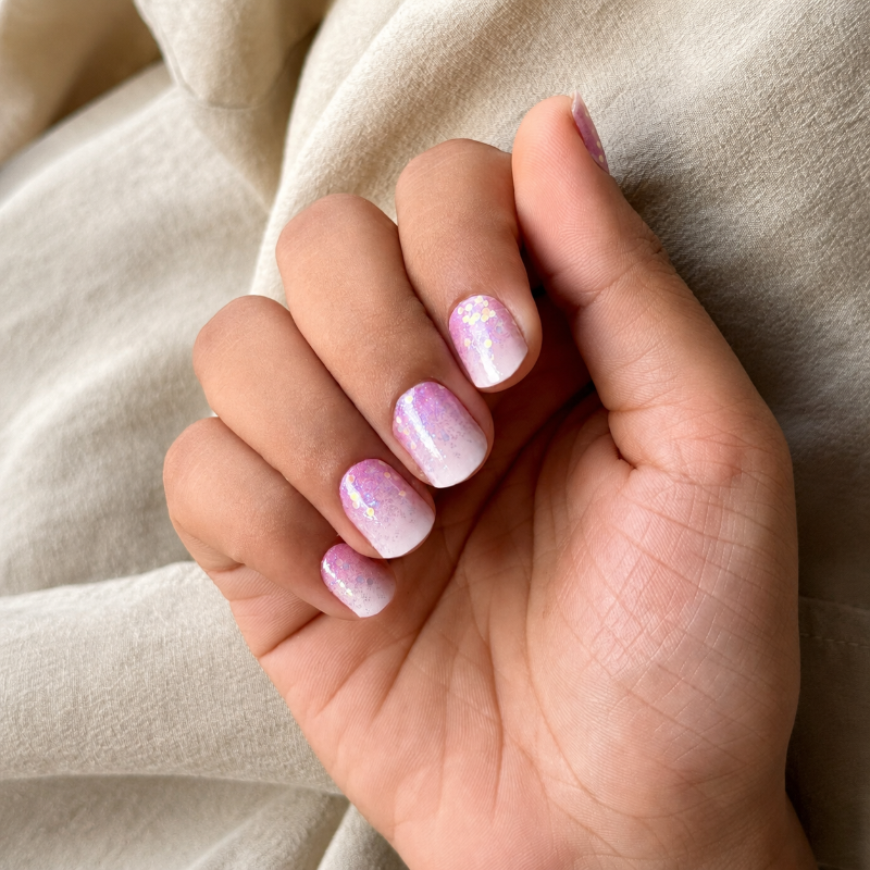 Hands wearing Cherry Blossom Nail Wraps by Namora 