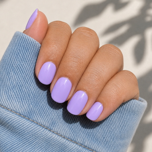 Hand wearing Lilac nail wraps by Namora