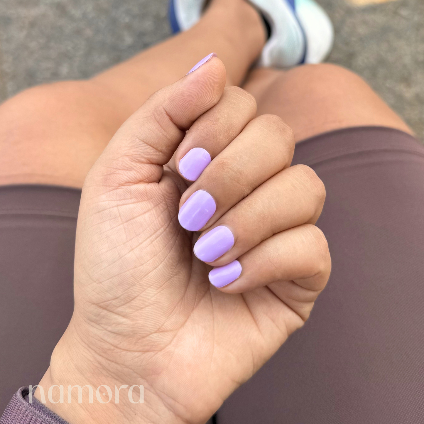 Hand wearing Lilac Nail Wraps by Namora
