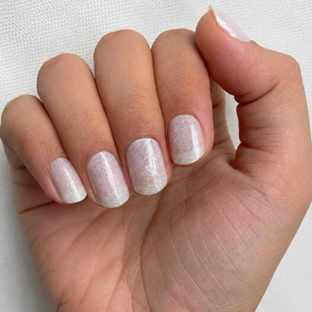 Hand wearing Milky Way nail Wraps by Namora