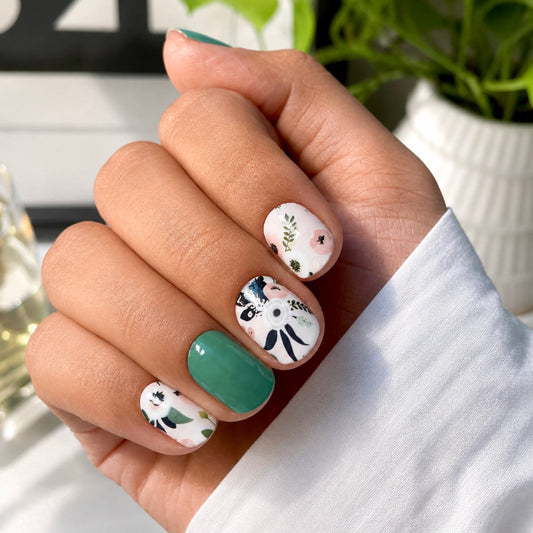 Hand wearing Moon Garden nail wraps by Namora