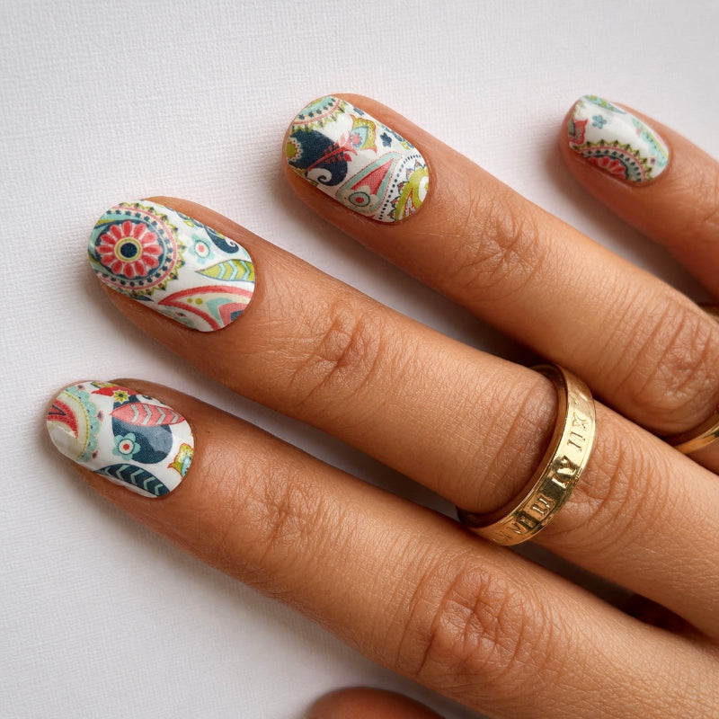 Hand wearing Paisley Print nail wraps by Namora