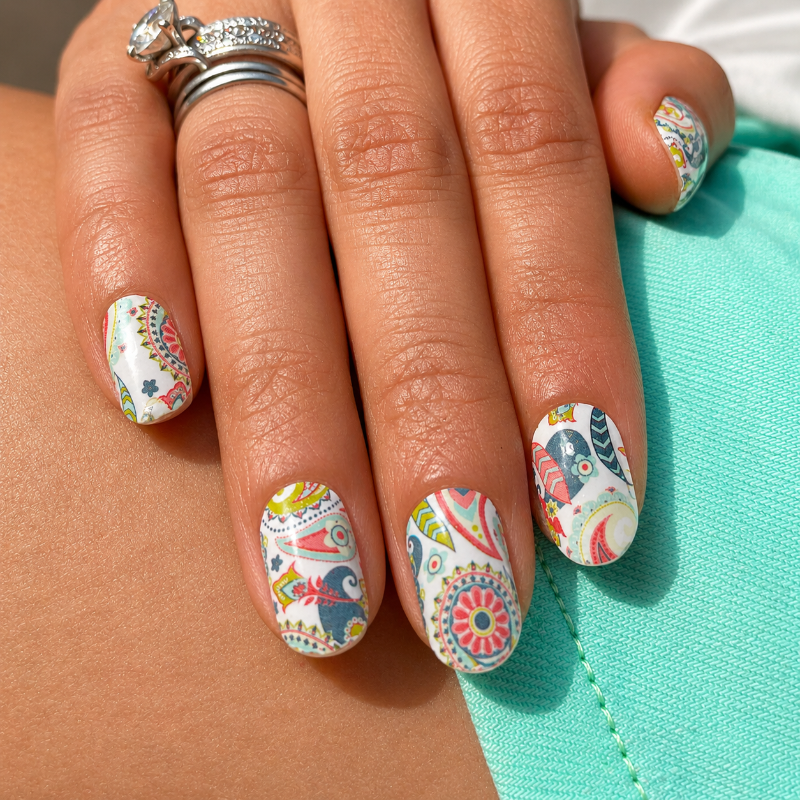 Hand wearing Paisley Print nail wraps by Namora