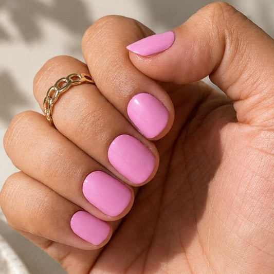 Hand wearing Pink Perfect Nail Wraps by Namora