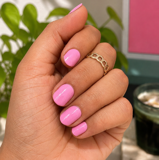 Hand wearing Pink Perfect Nail Wraps by Namora 