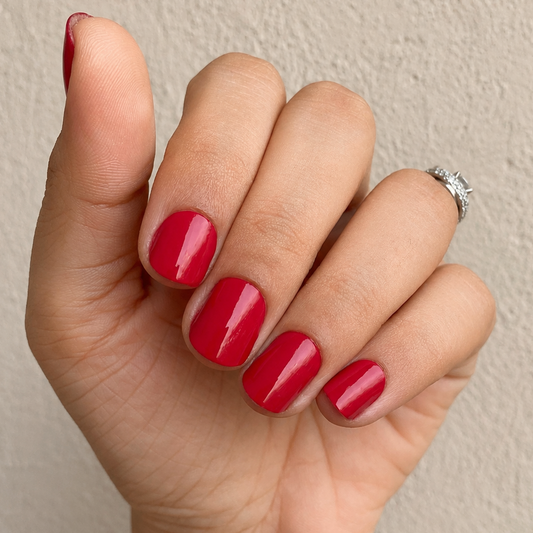 Hand wearing Ruby Who Nail Wraps by Namora 