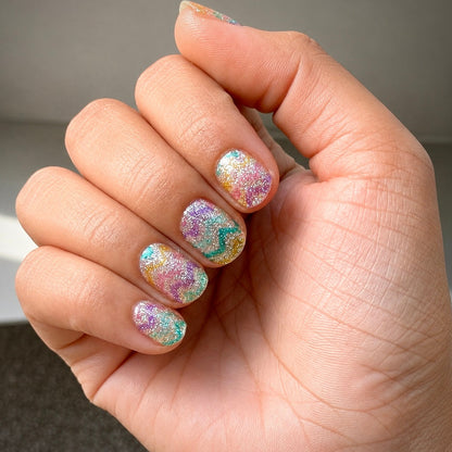 Hand wearing Shimmy Jimmy nail wraps by Namora