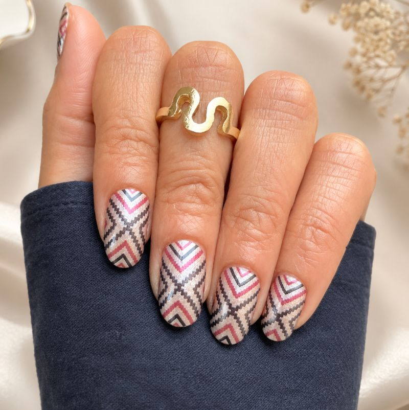 Hand wearing Tribe Vibe Nail Wraps by Namora 