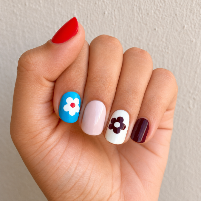 Hand wearing Vintage Pop Nail Wraps by Namora 