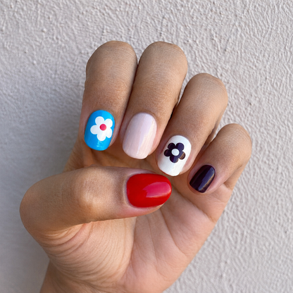 Hand wearing Vintage Pop Nail Wraps by Namora 
