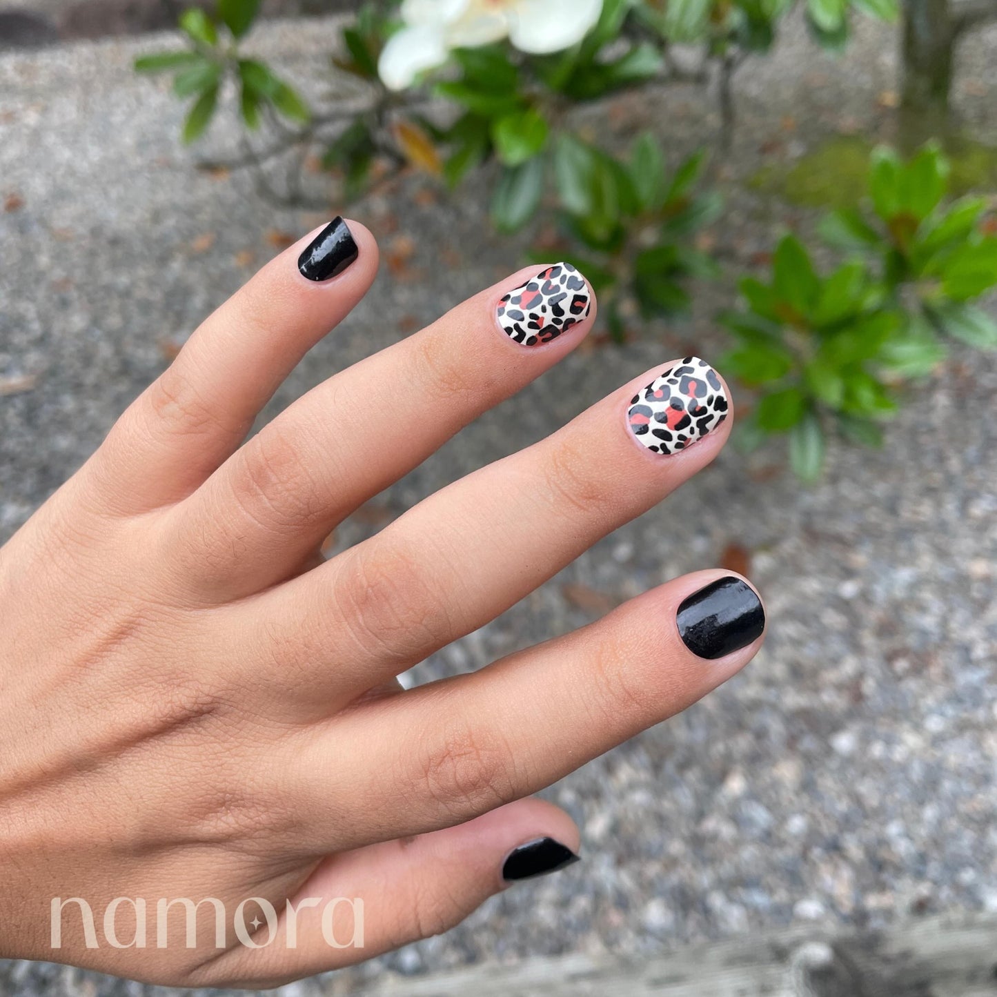 Hand wearing Wild Cat Nail Wraps by Namora