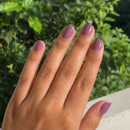 Hand wearing Deep Plum nail Wraps by Namora