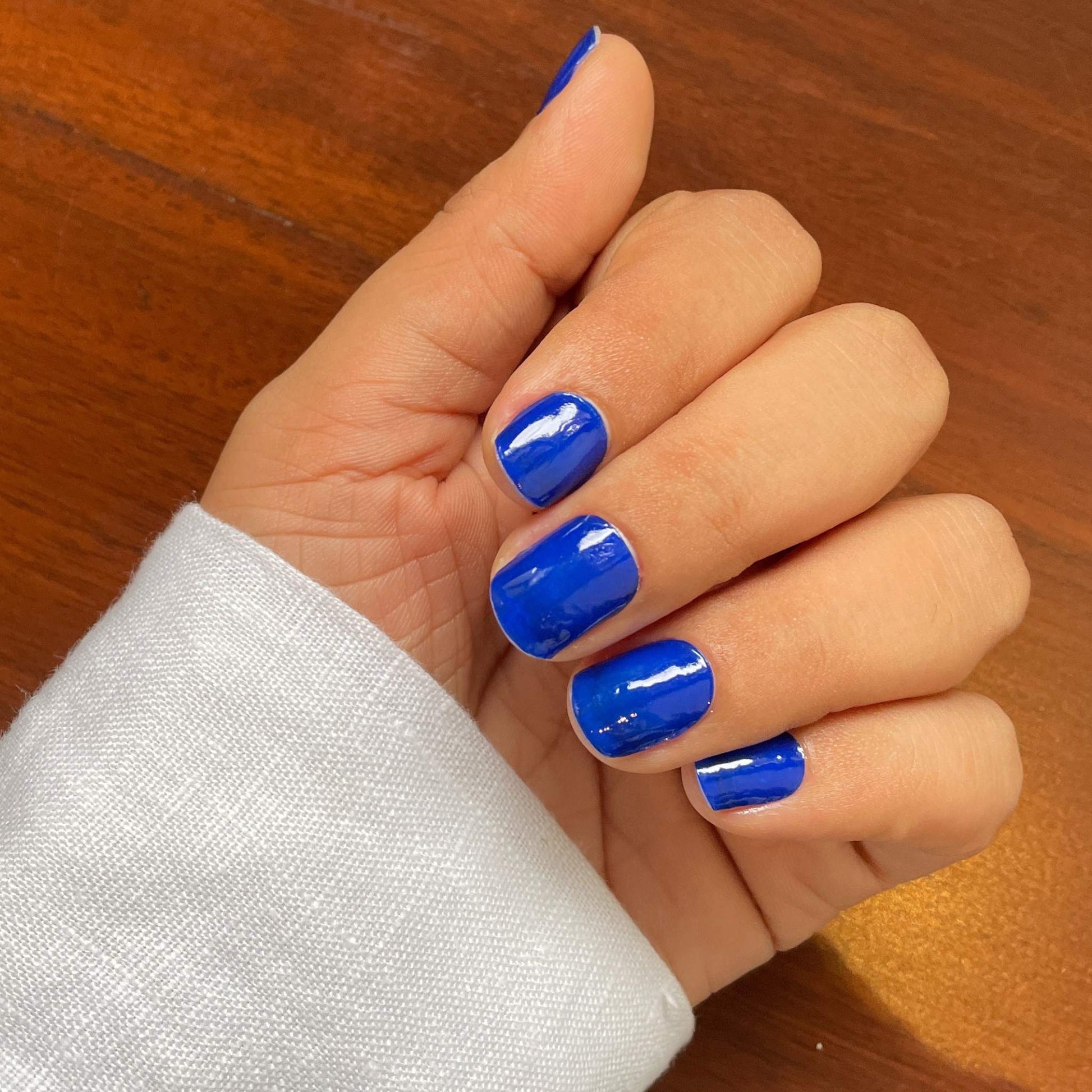 hand weariong Electric Blue Namora nail wraps