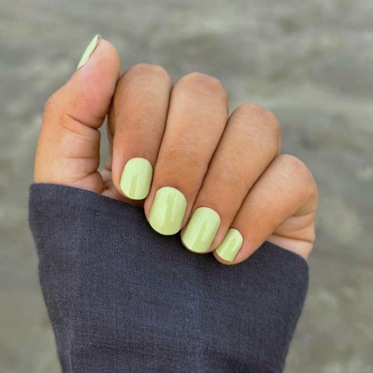 Hands wearing matcha latte Nail Wraps by Namora 